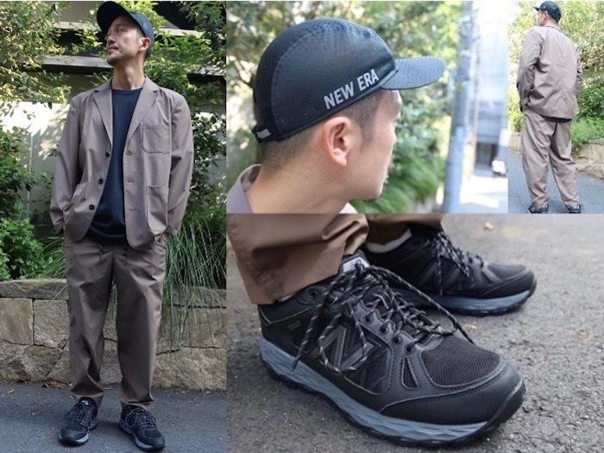 キャップとテーラードを合わせたコーデをした男性の写真
